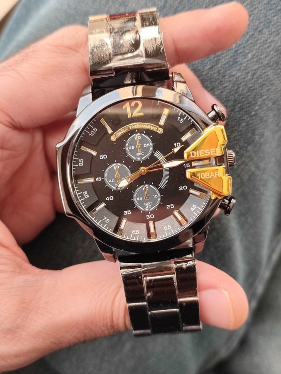 ساعت دیزل مردانه بنداستیل مشکی شاخ طلایی کد 369284
