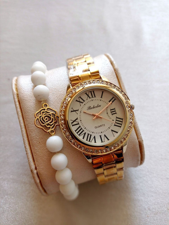 ساعت زنانه بنداستیل طلایی توپر همراه با دستبند کد 55018